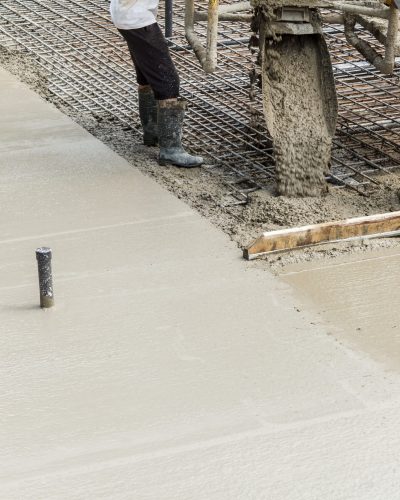 pouring-concrete-into-the-construction-of-the-hous-2022-04-01-10-02-03-utc-scaled.jpg